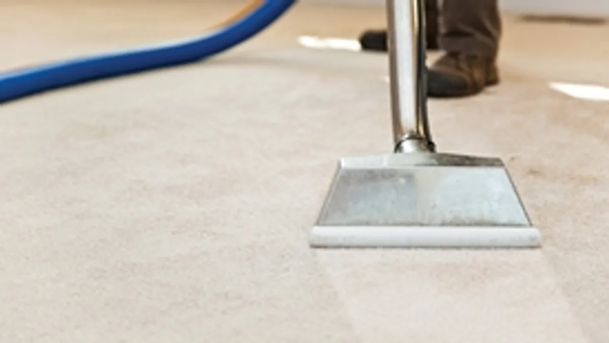 Carpet cleaning wand head gliding over a light carpet during hot-water extraction, Shreveport, LA.